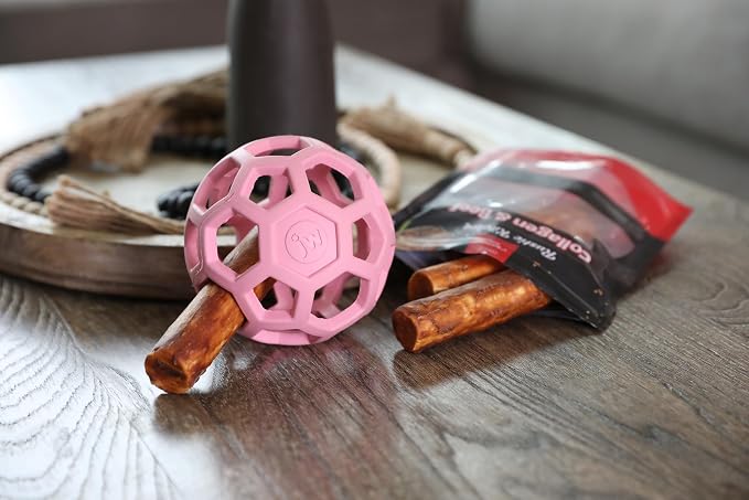 JW Pet HOL-ee Roller Dog Puzzle Ball, Medium 4.5in, Natural Rubber, Pink | Puzzle Ball Design Dog Toy for Interactive Play and Chasing Fun